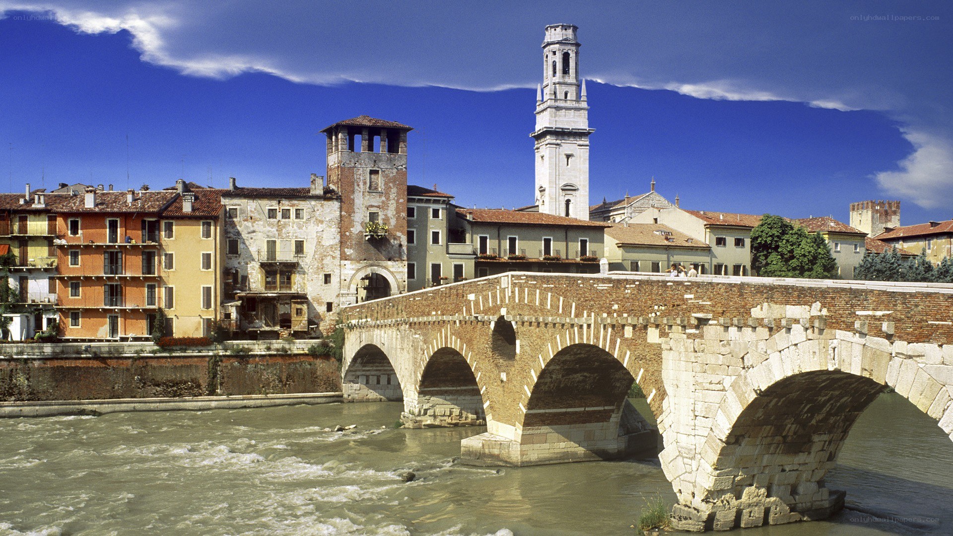 ancient bridge over river in italy