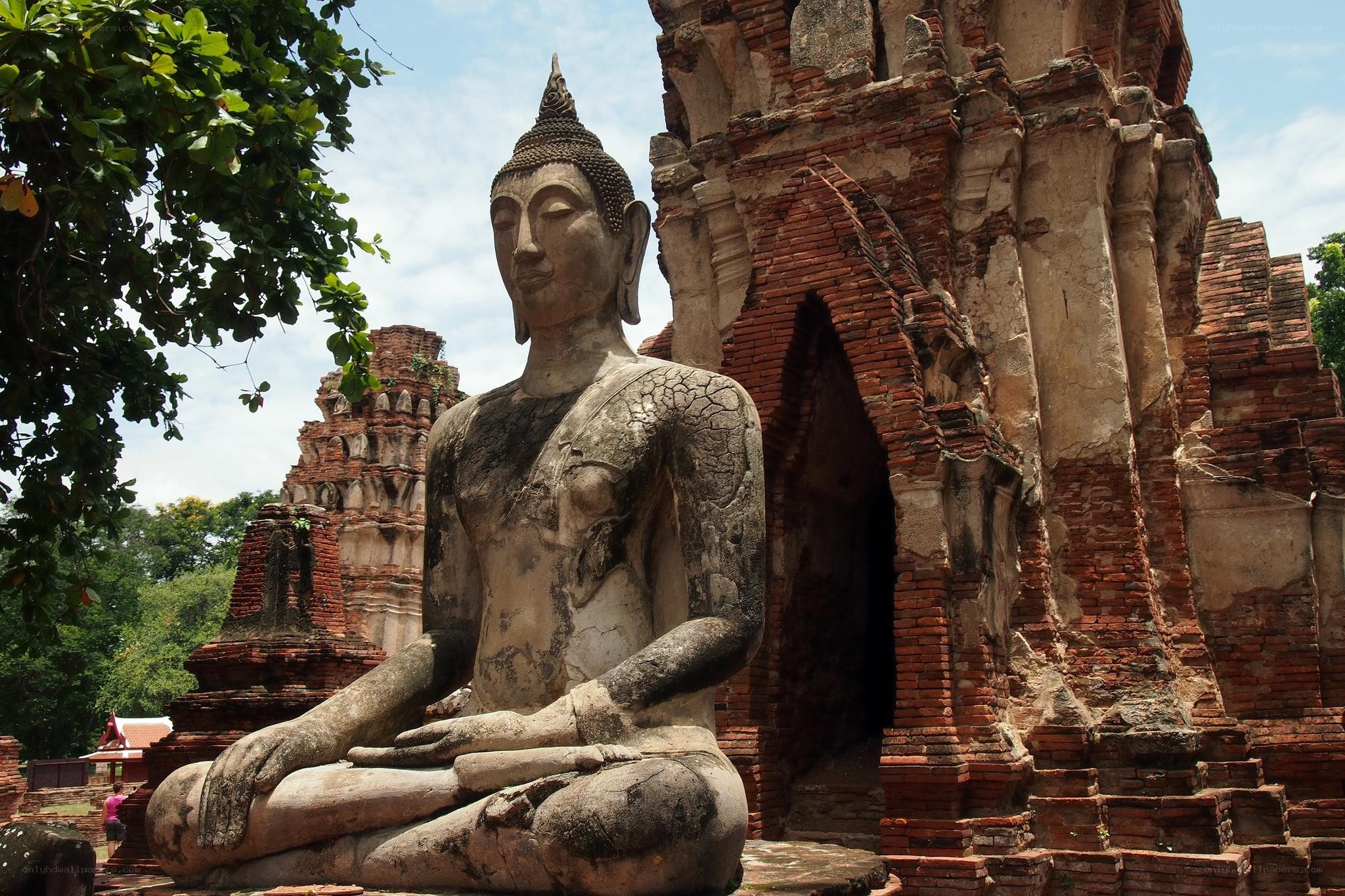 Ancient Buddha statue at temple ruins