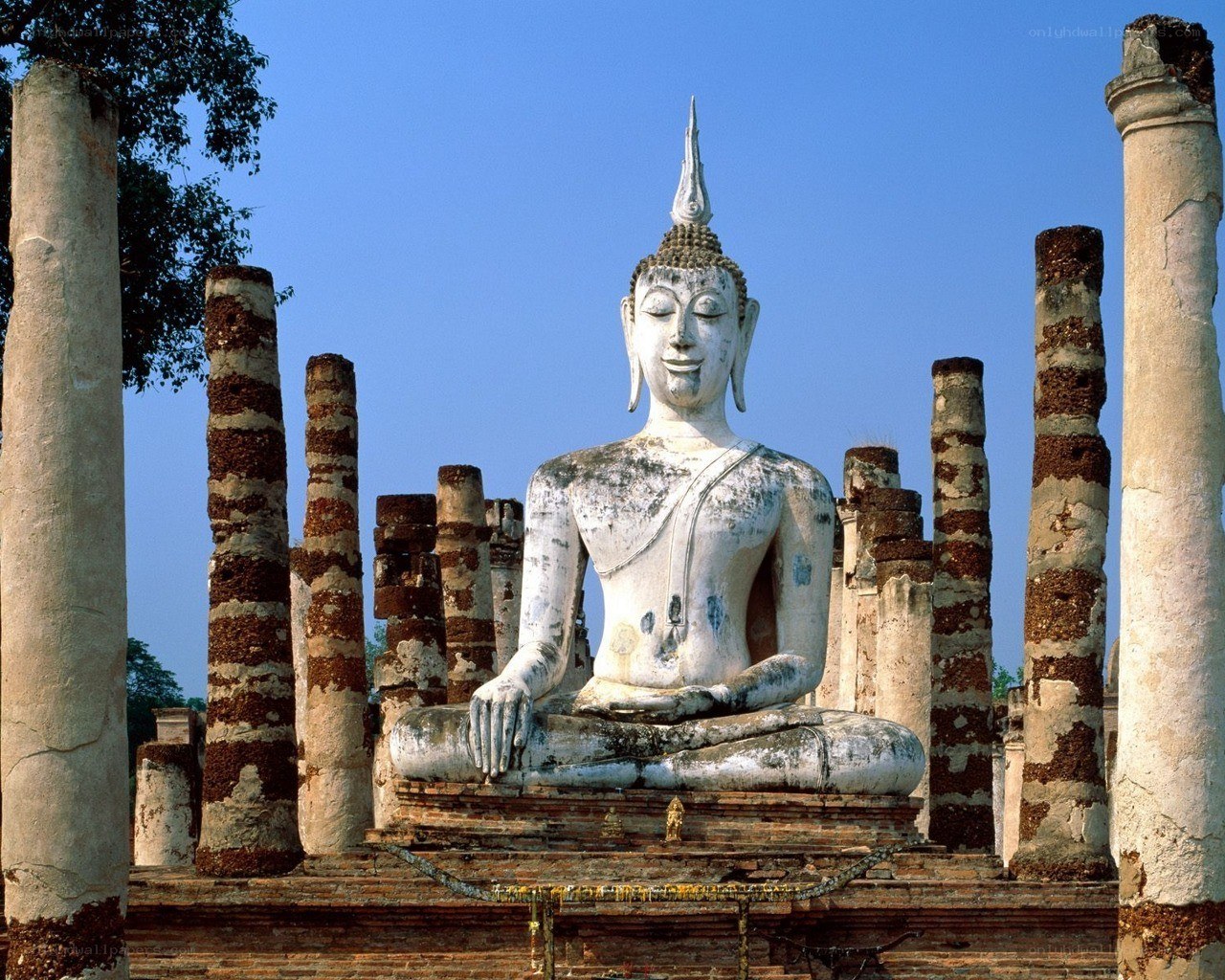 Ancient Buddha statue in ruins
