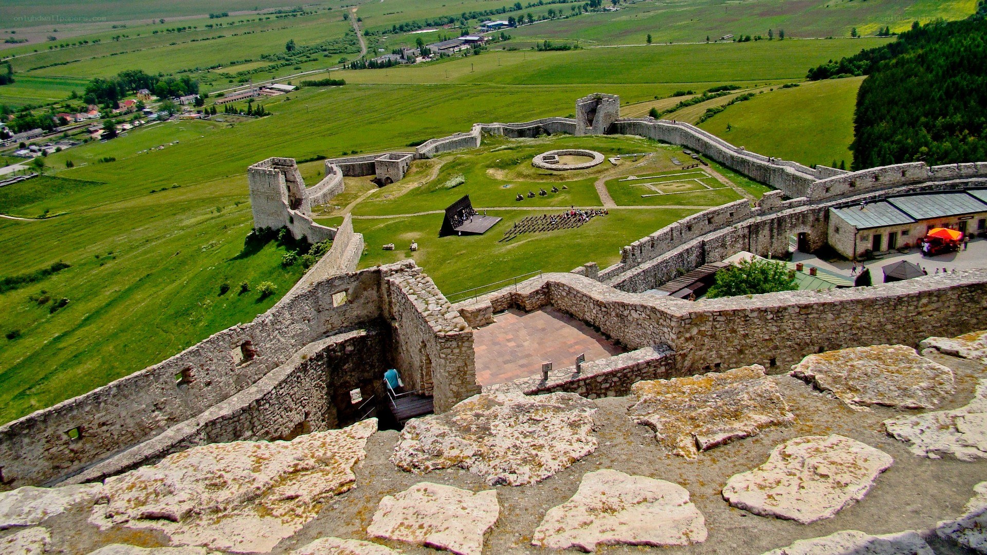 ancient castle ruins with green fields