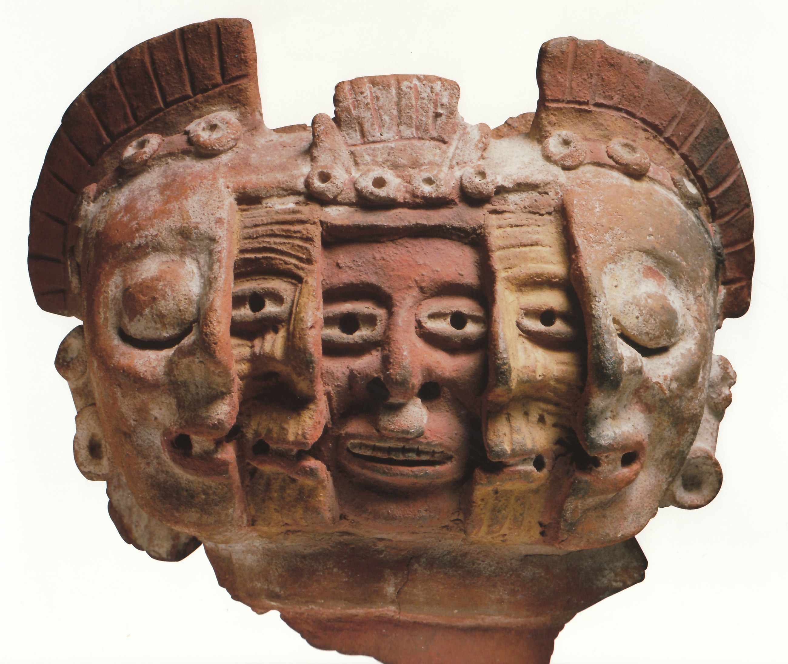 ancient ceramic mask with multiple faces