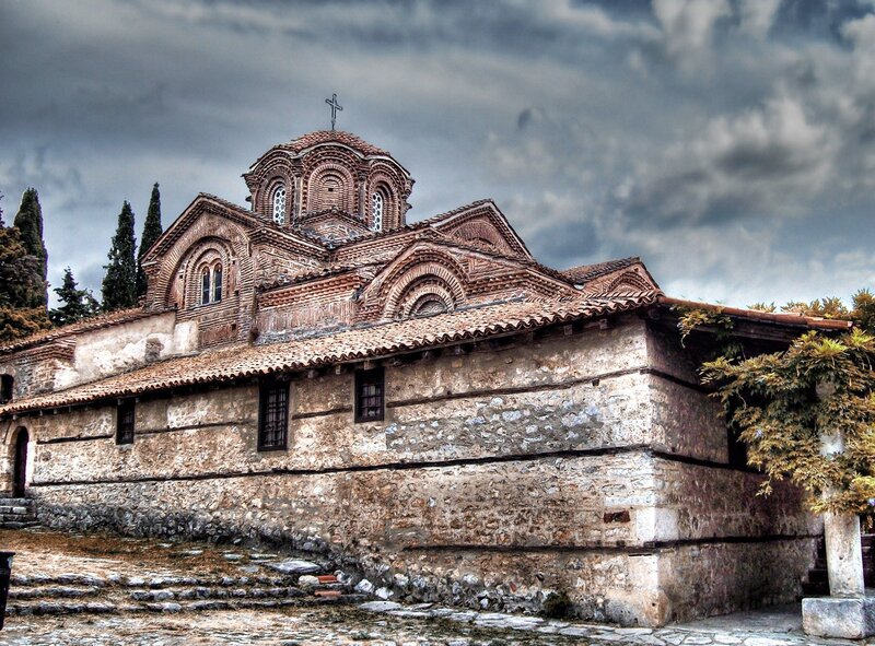 ancient church under cloudy sky