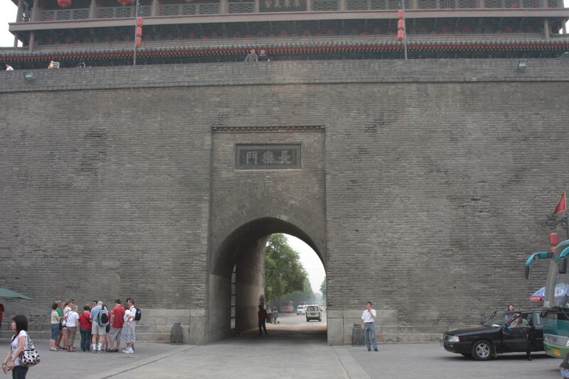 Ancient city gate with tourists