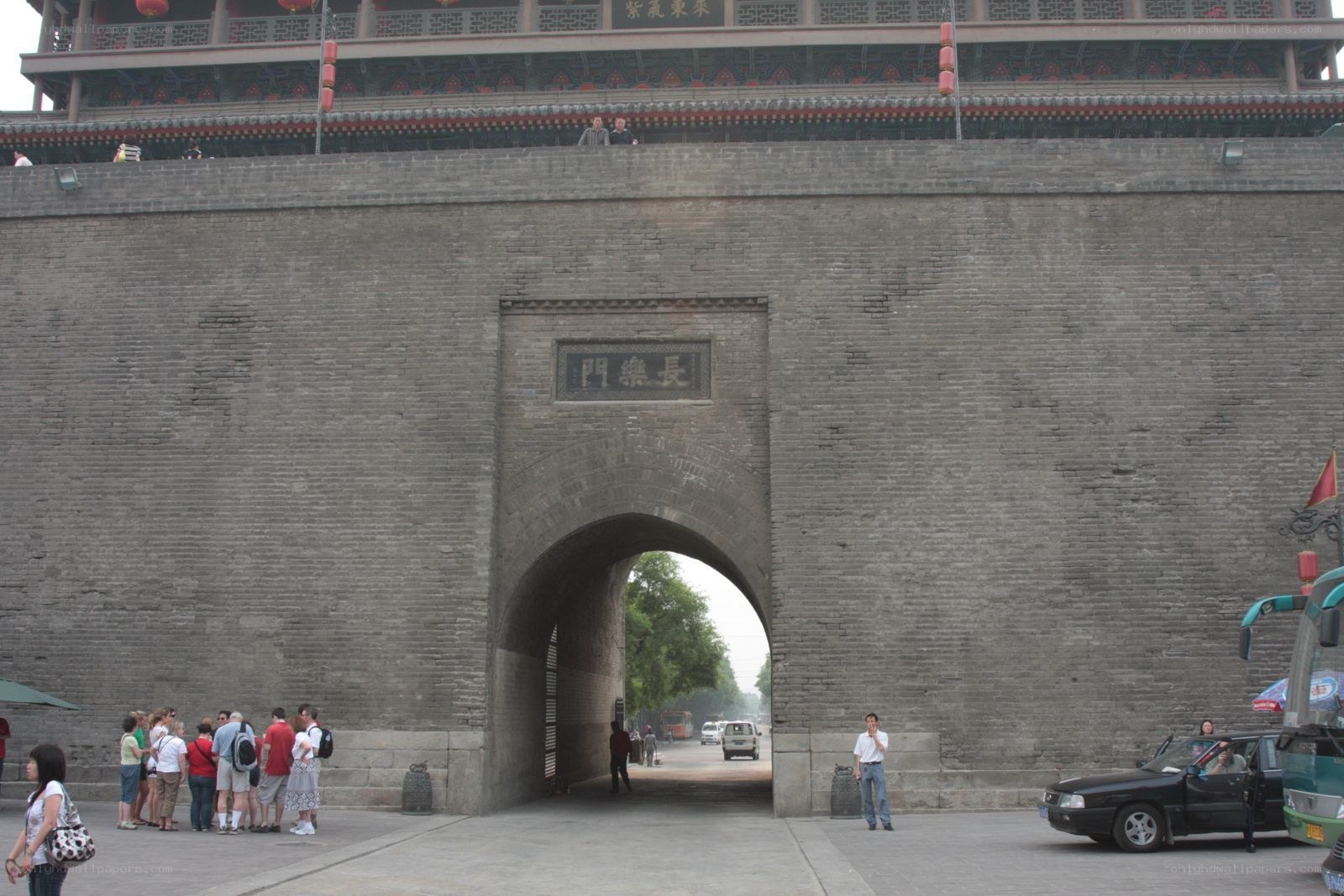 Ancient city gate with tourists