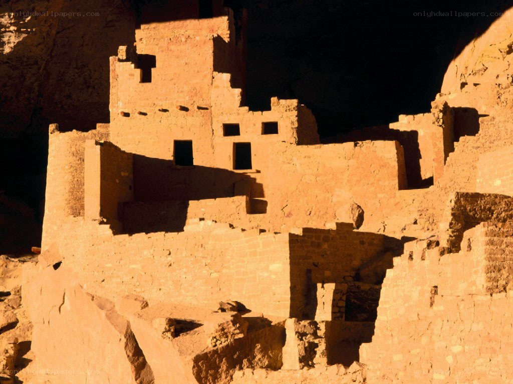 Ancient cliff dwelling at sunset