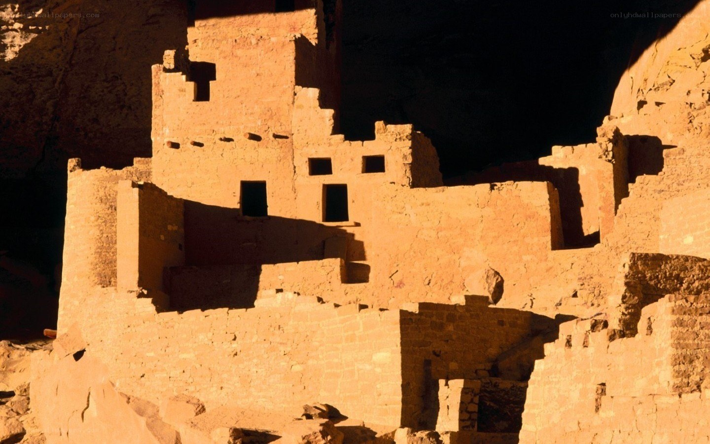 Ancient cliff dwelling at sunset