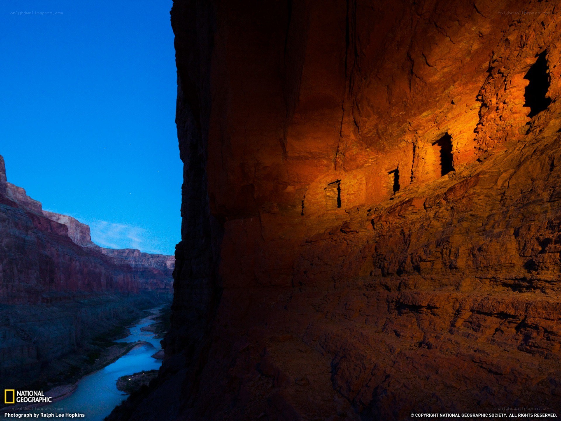 Ancient cliff dwellings at dusk