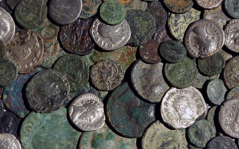 ancient coins in a pile