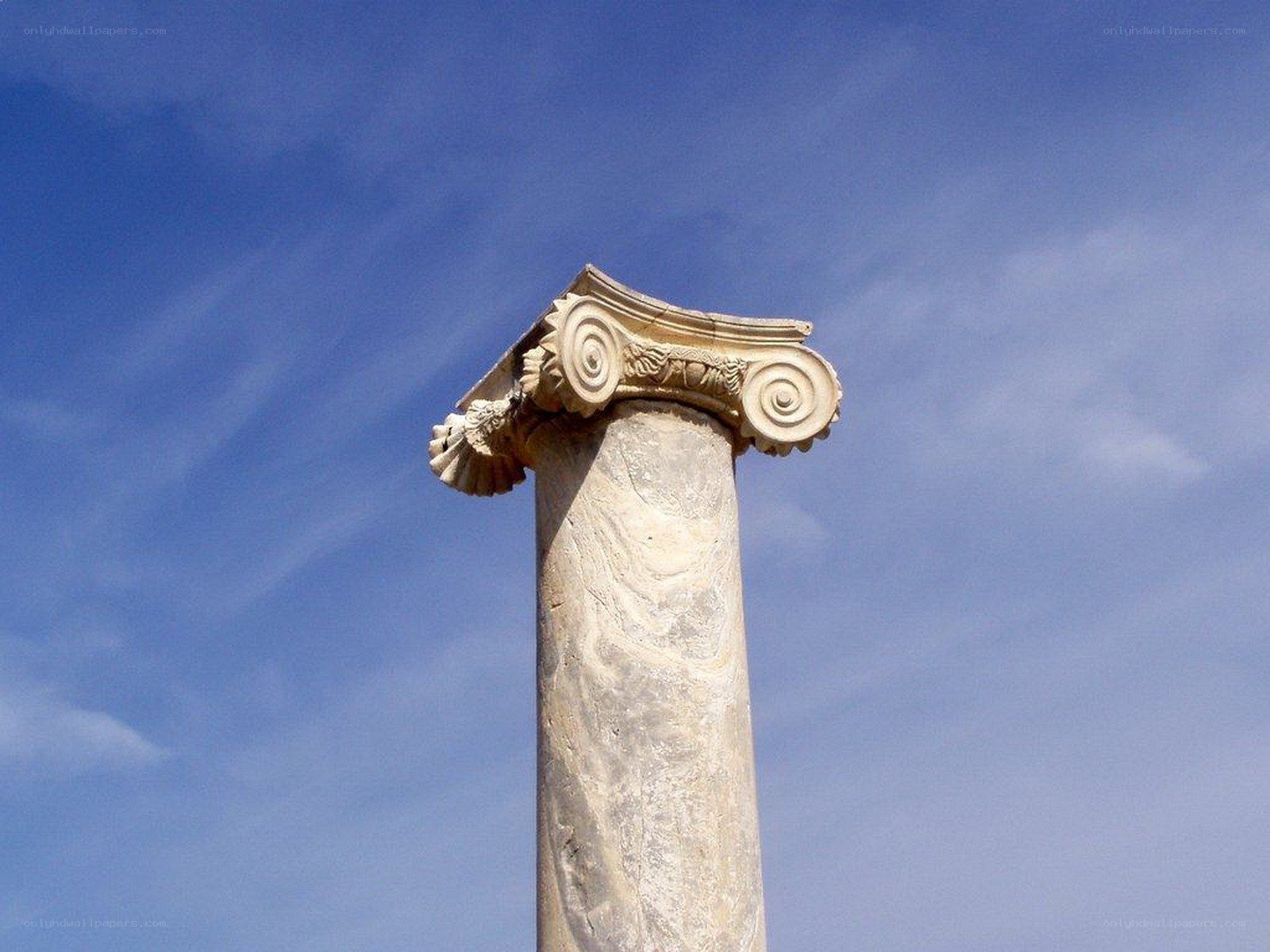 ancient column against blue sky