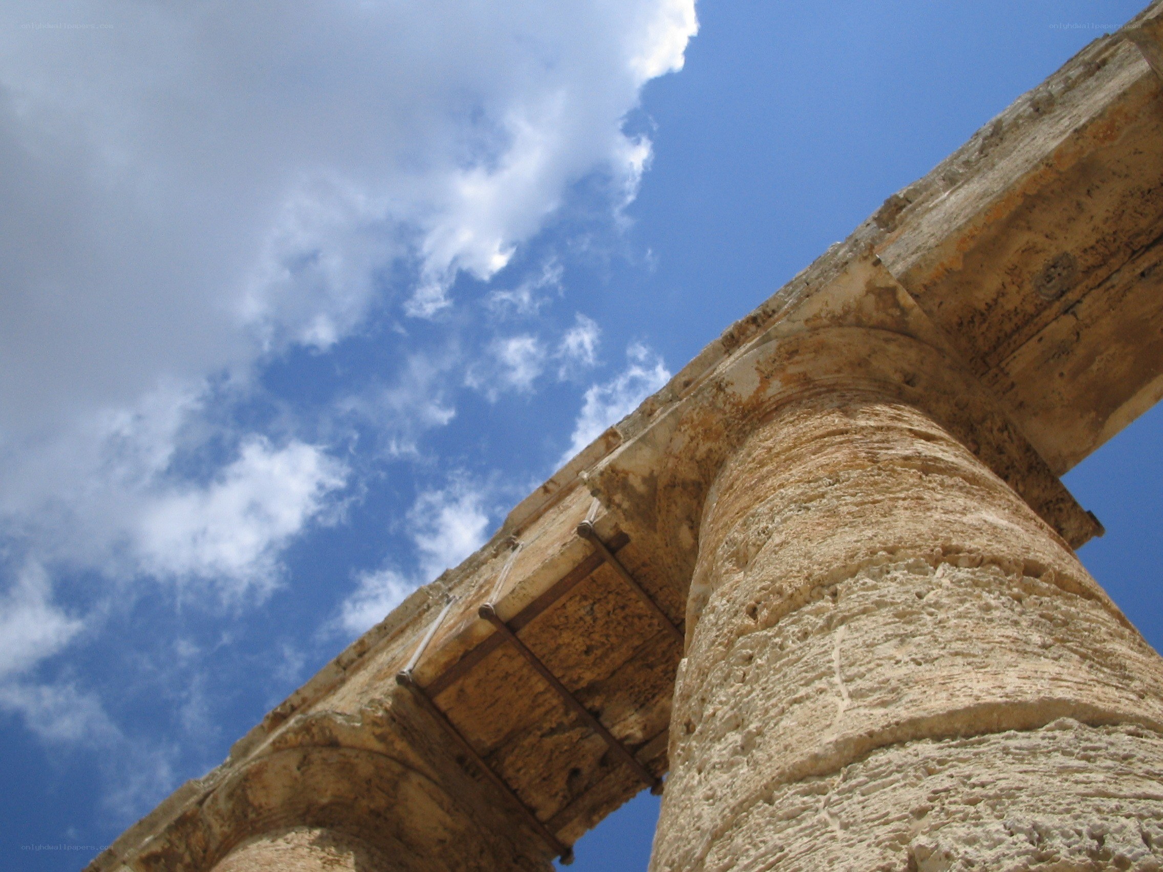 ancient column against blue sky