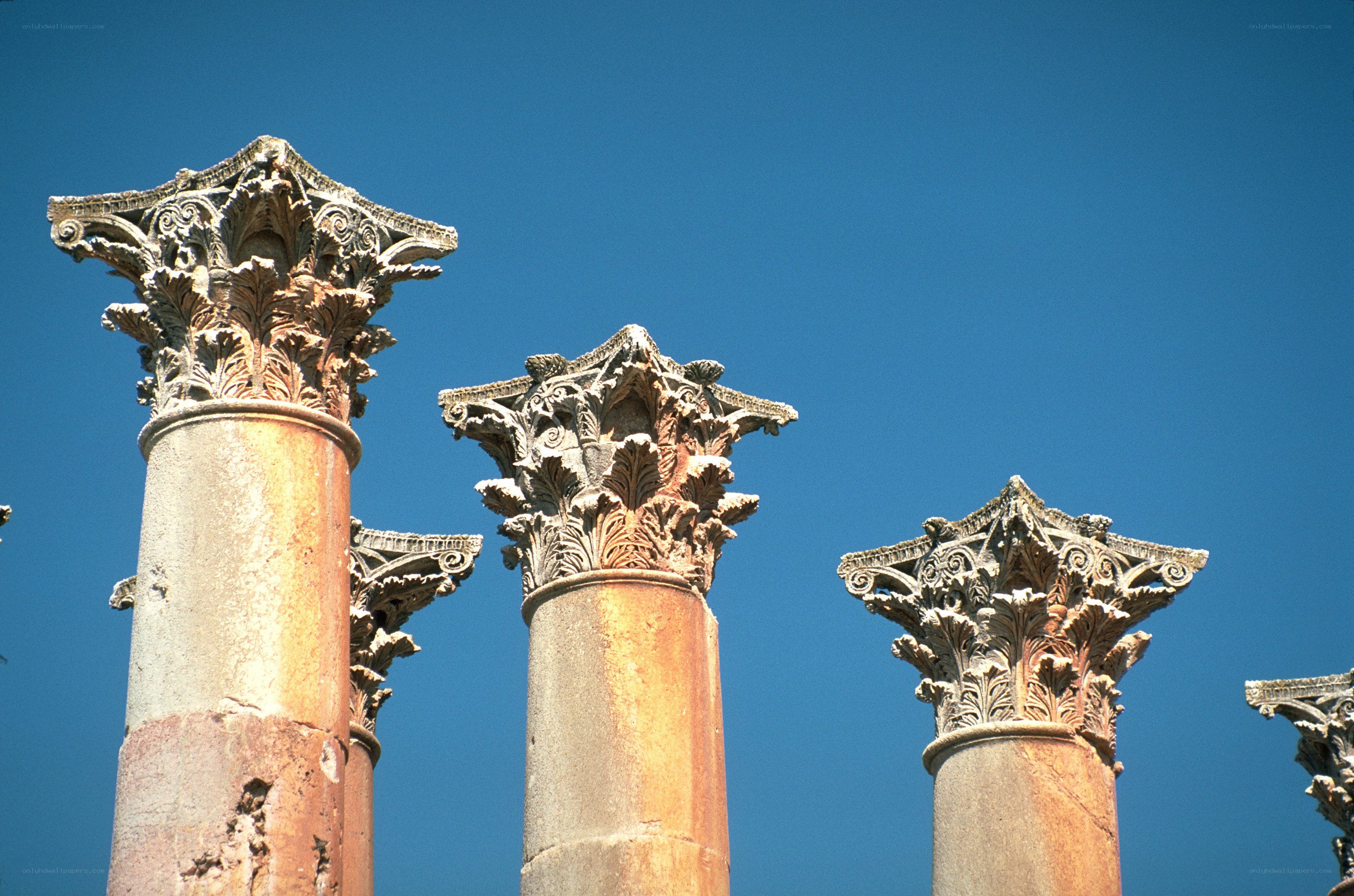 ancient columns against blue sky