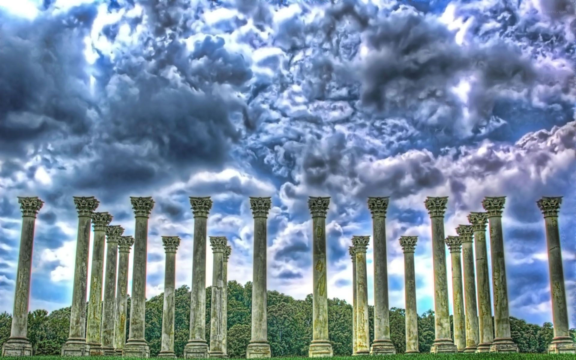 ancient columns under stormy sky