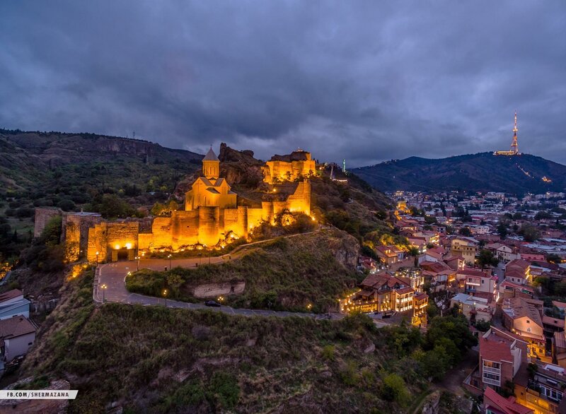 Ancient Fortress at Dusk — Orange