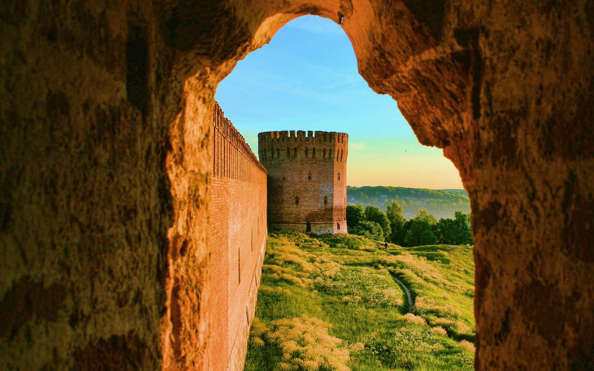 ancient fortress through stone arch