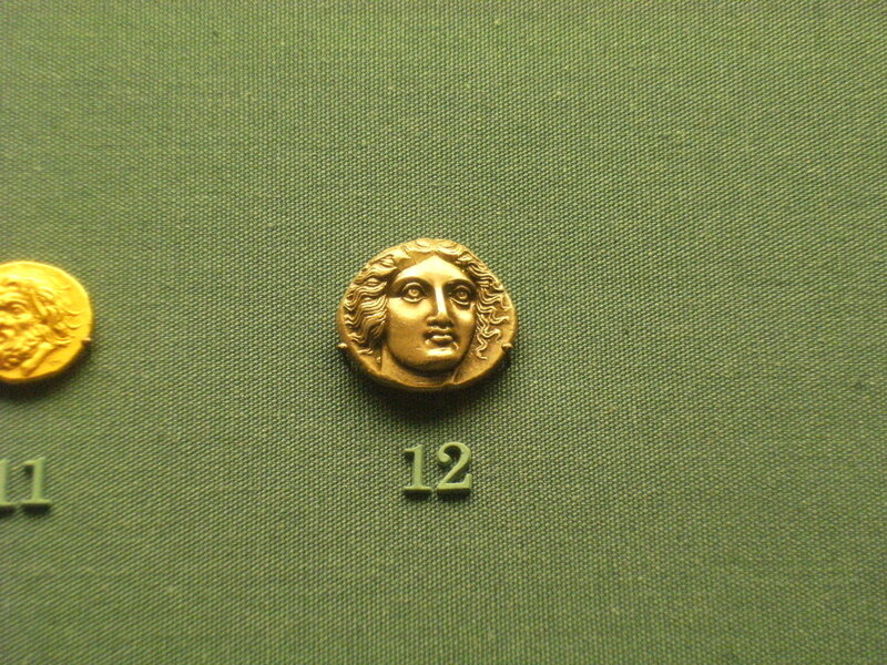 ancient gold coin with head