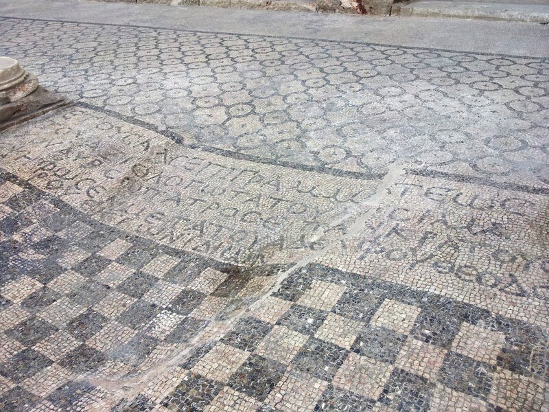 ancient mosaic floor with inscriptions