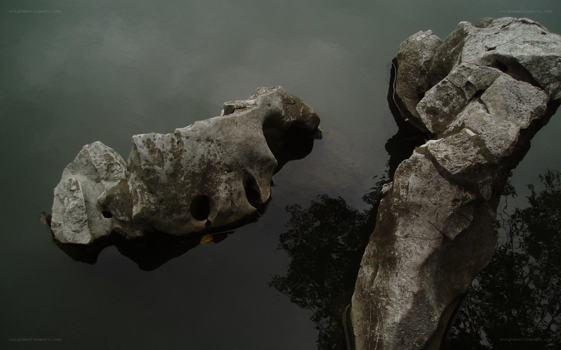 ancient rocks in calm water