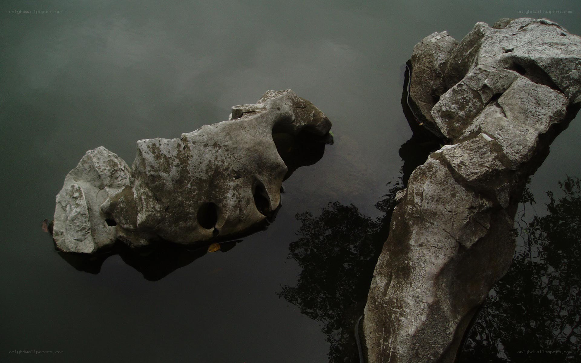 ancient rocks in still water