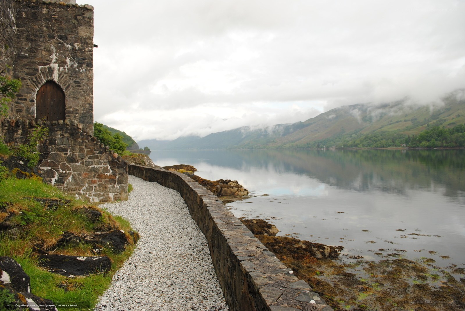 Ancient ruin by a misty loch