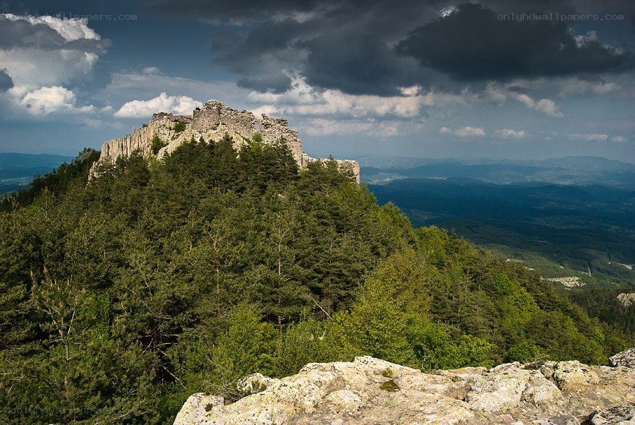 Ancient ruins on a forested hill