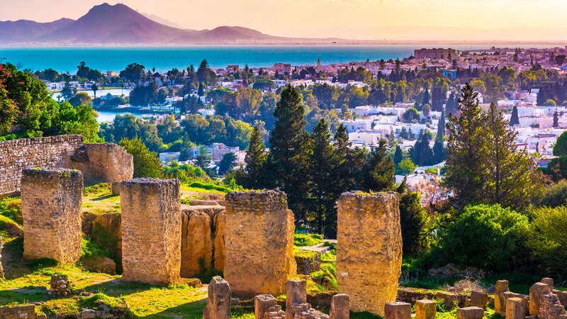Ancient Ruins Overlooking City — Green