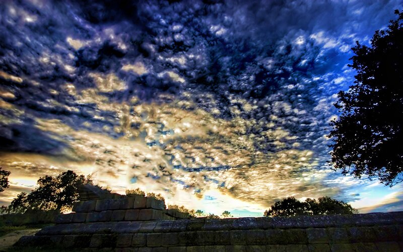 ancient ruins under dramatic sky