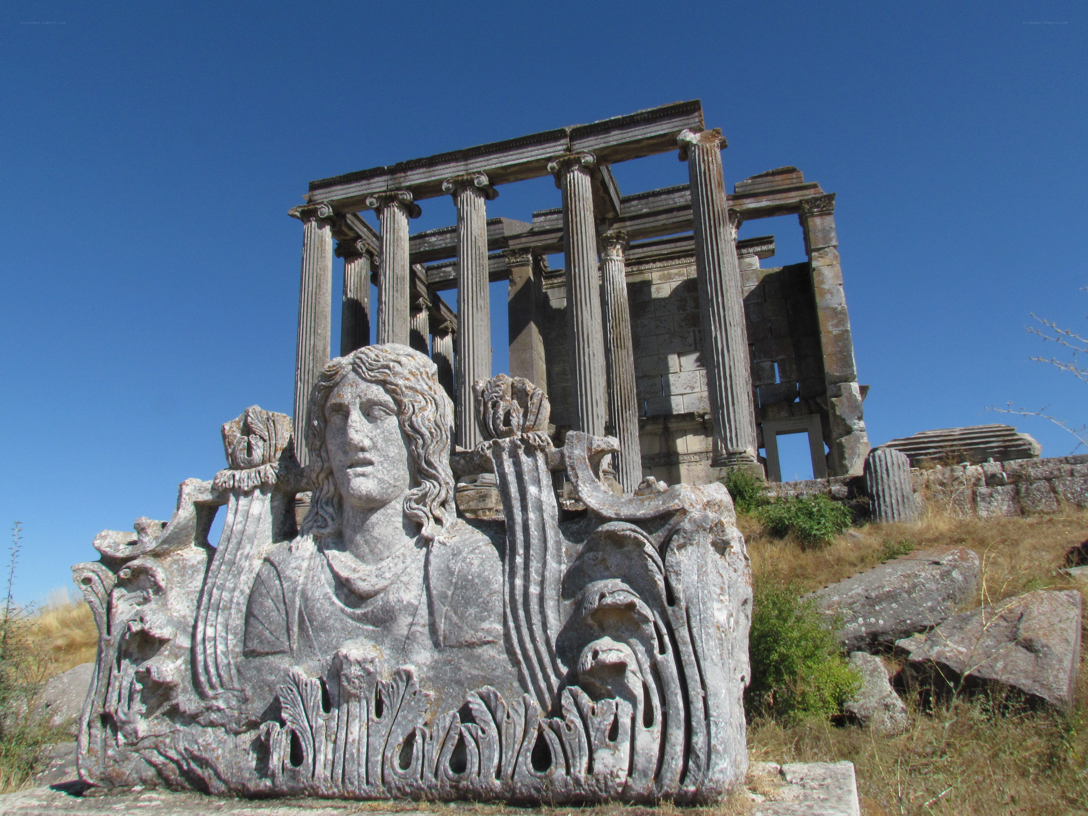 Ancient ruins with statue
