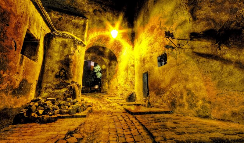 ancient stone alley at night