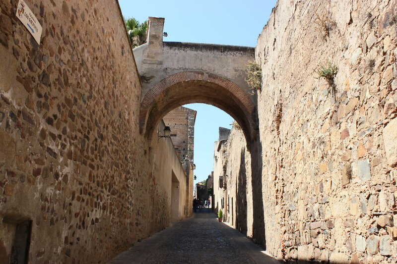 ancient stone alley with arch