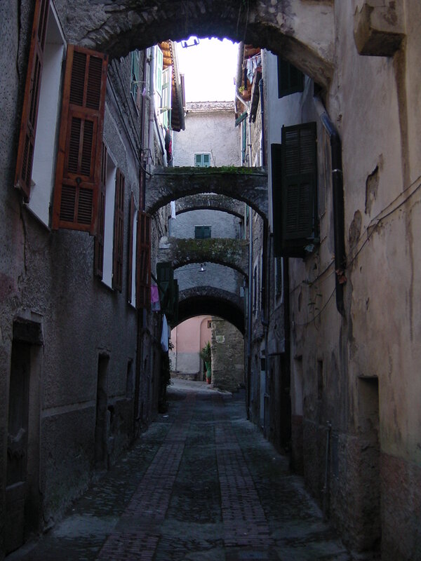 ancient stone alley with arches