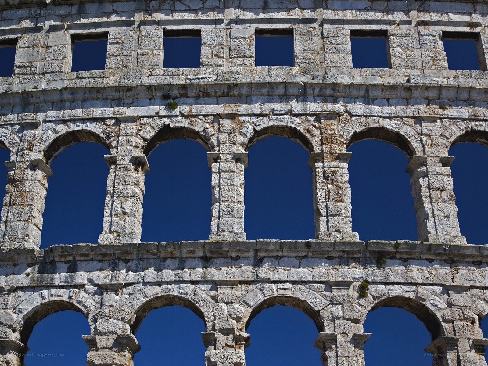 Ancient stone amphitheater facade
