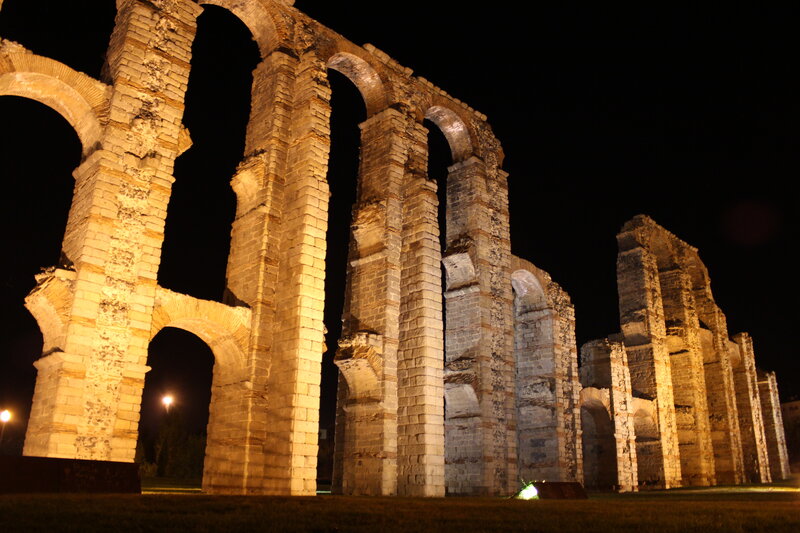 Ancient Stone Aqueduct — Brown, Dramatic