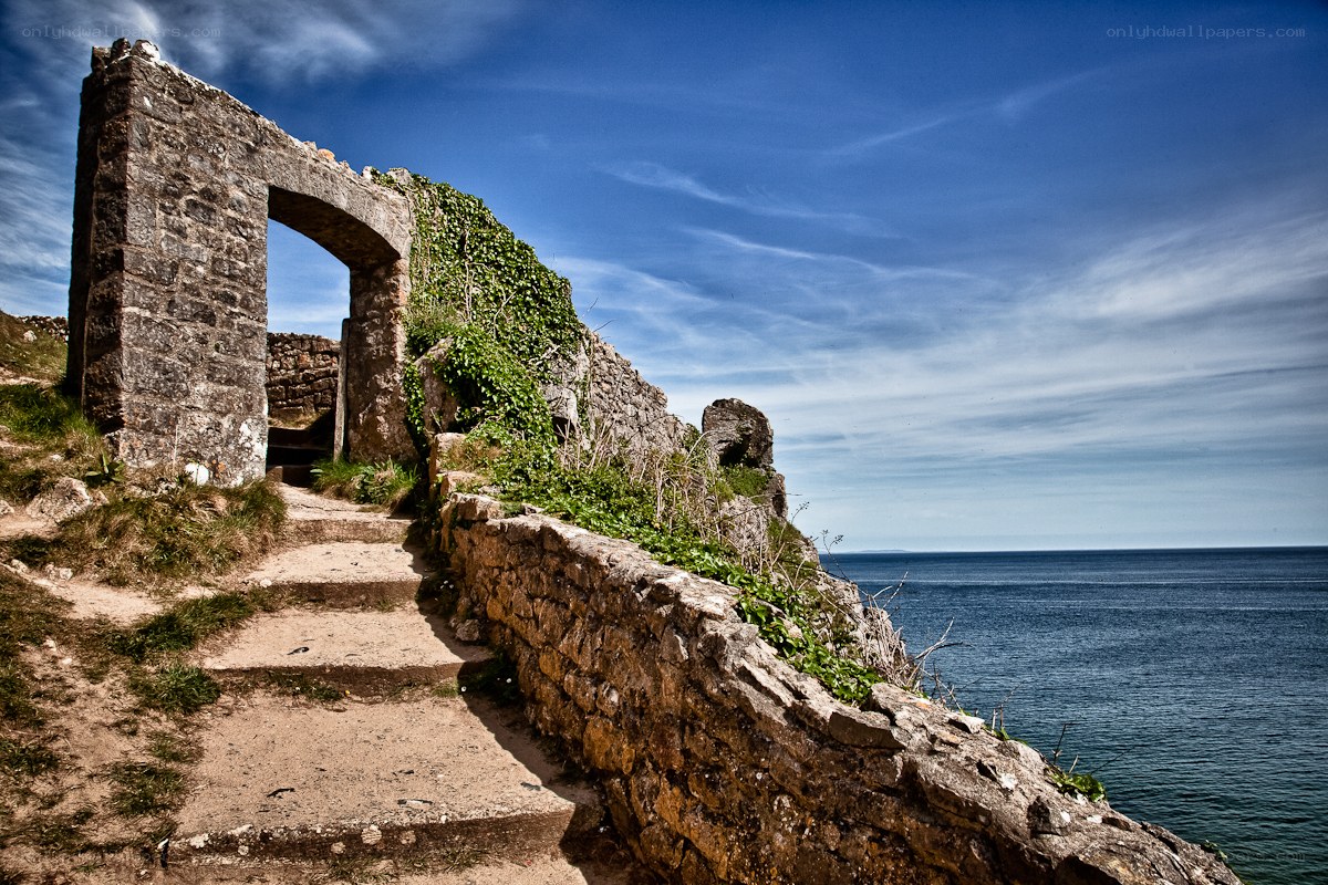 ancient stone arch by the sea