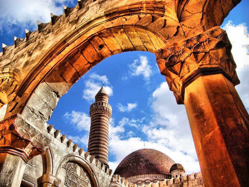 ancient stone arch with mosque