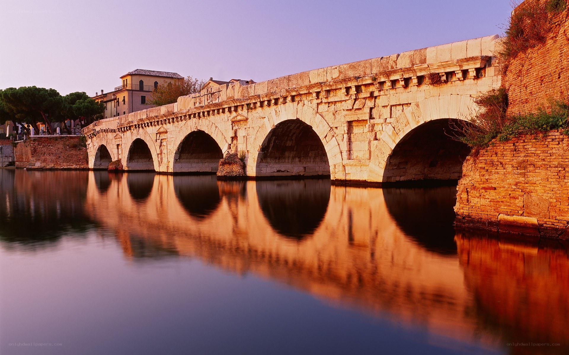 Ancient stone bridge at sunset