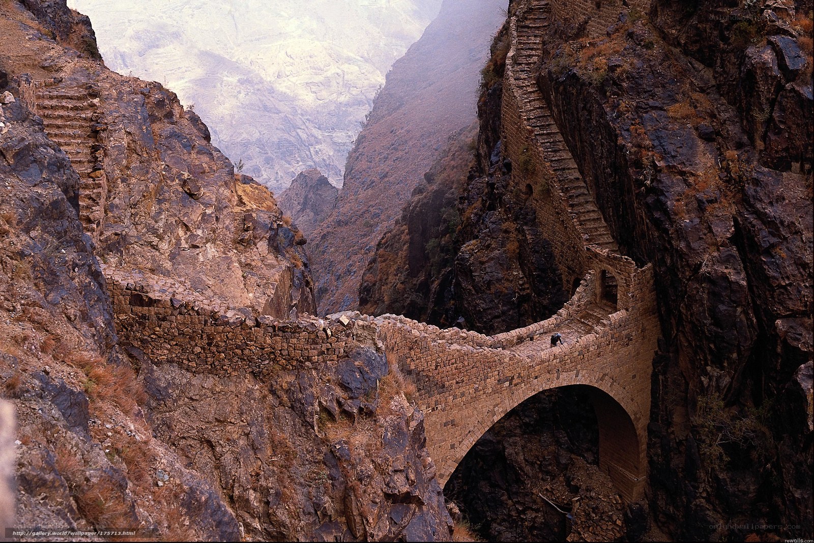 ancient stone bridge in canyon
