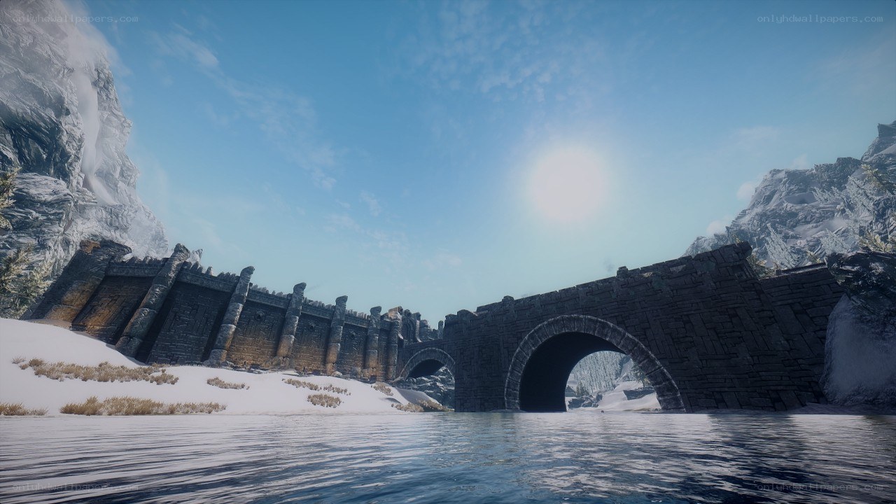 ancient stone bridge in snowy landscape
