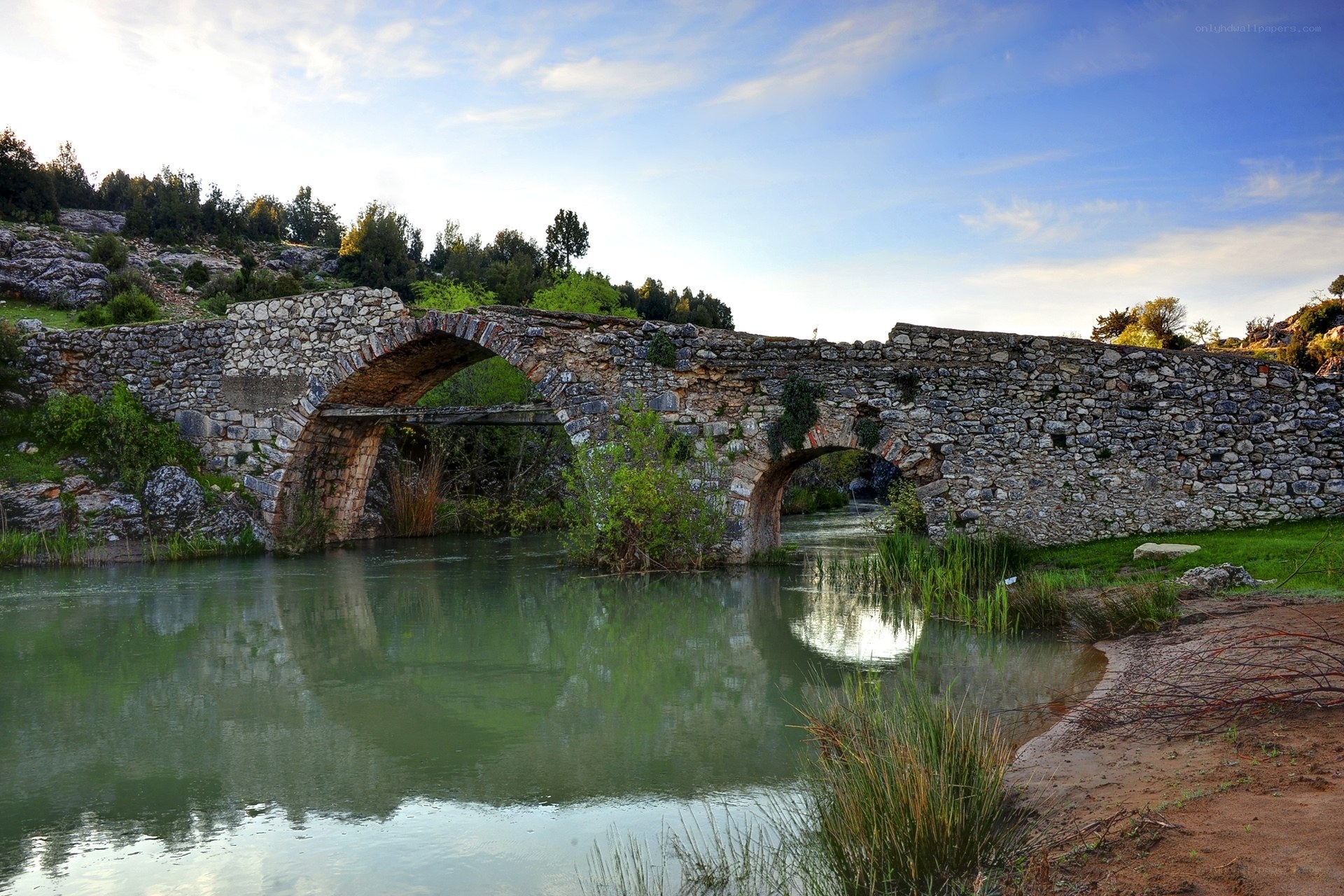 Ancient stone bridge over river