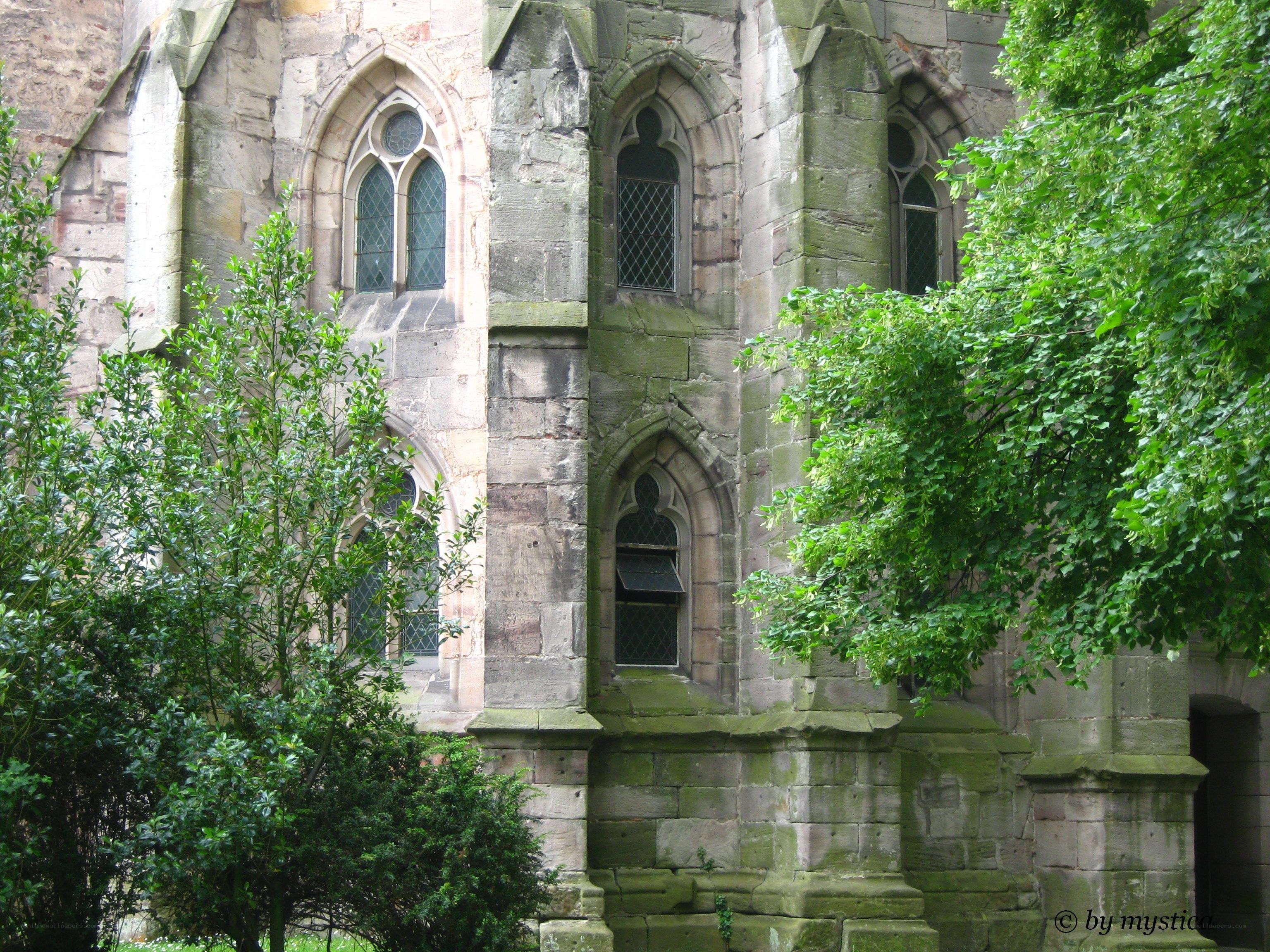 ancient stone building with arched windows