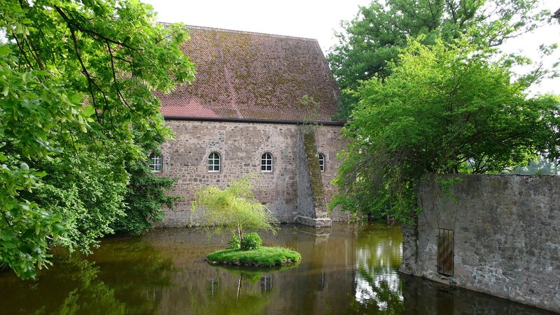 ancient stone building with moat