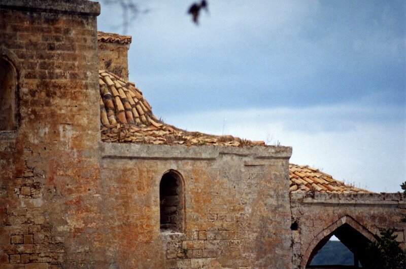 ancient stone building with tiled roof