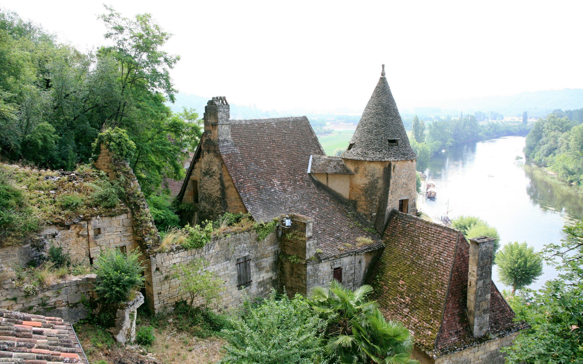 ancient stone buildings by a river