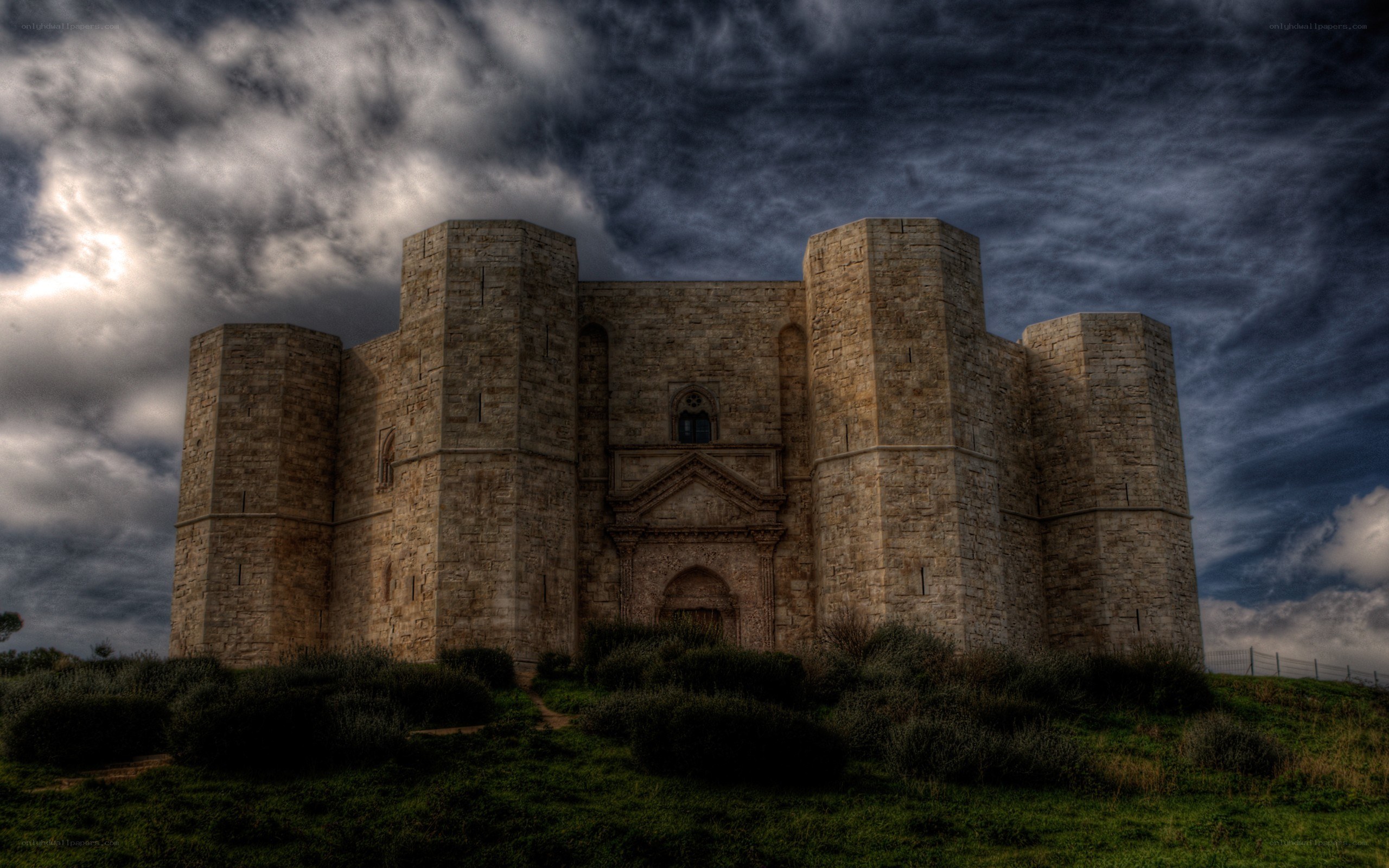 ancient stone castle under stormy sky