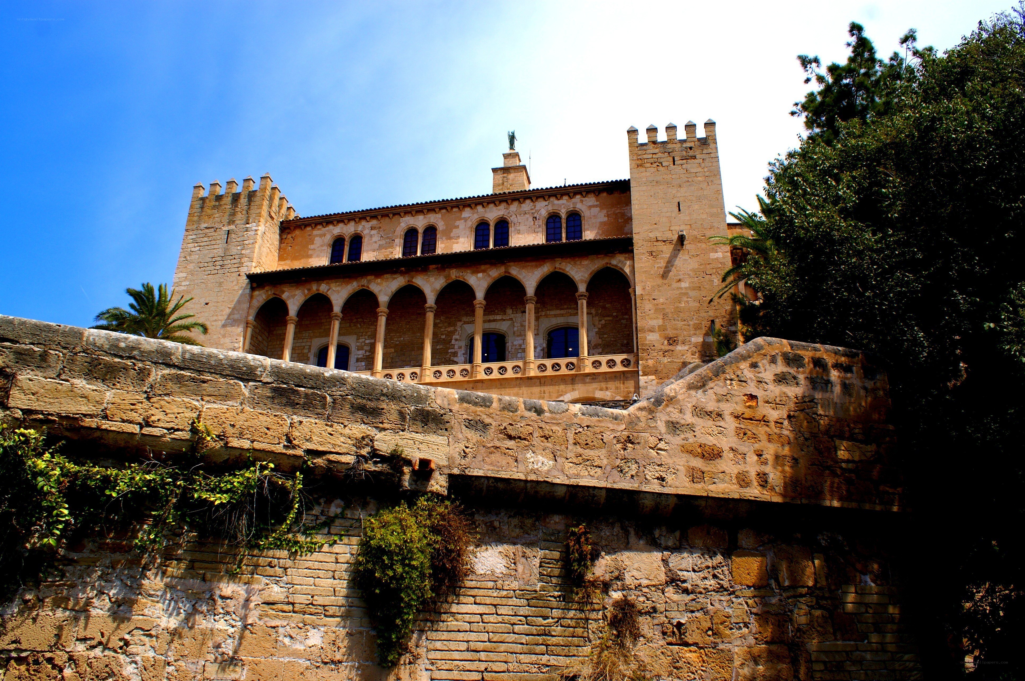 ancient stone castle with arched balcony