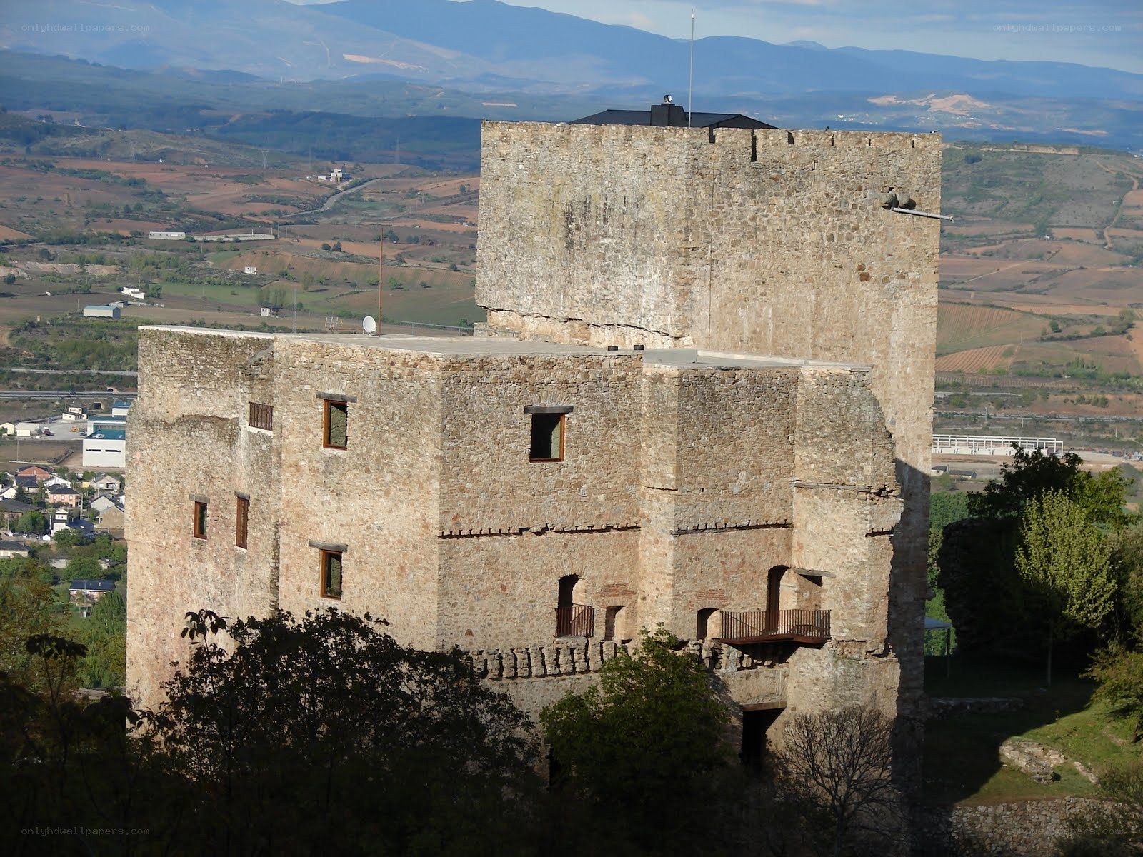 ancient stone castle with mountain view