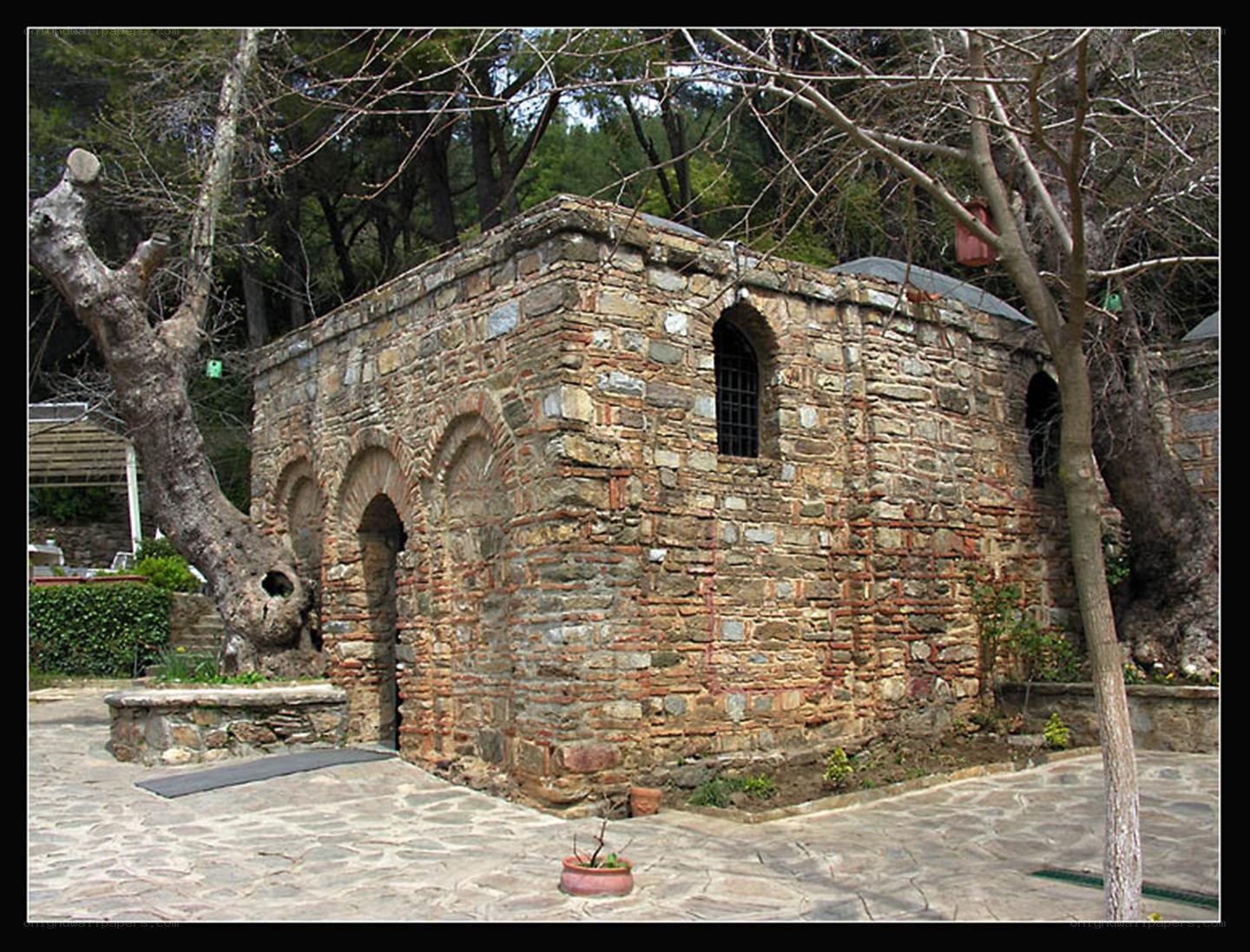 ancient stone chapel in forest