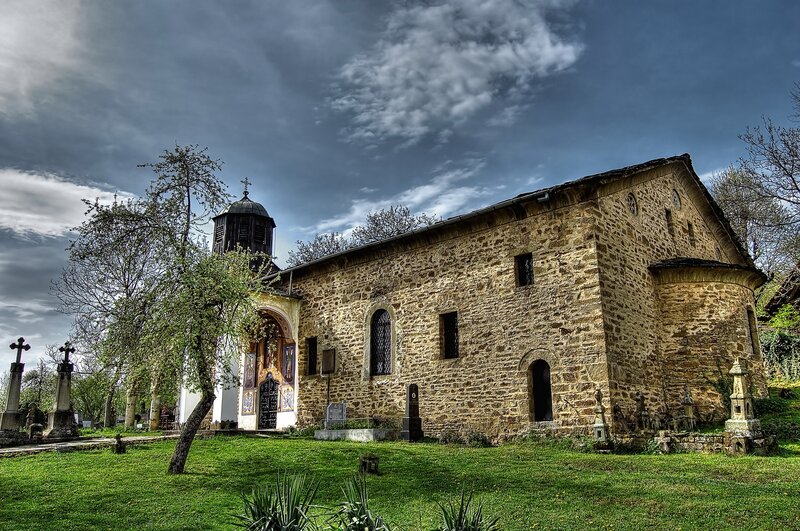 Ancient stone church with cemetery