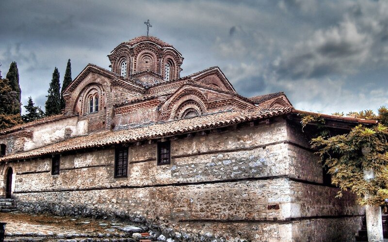 Ancient stone church with cross