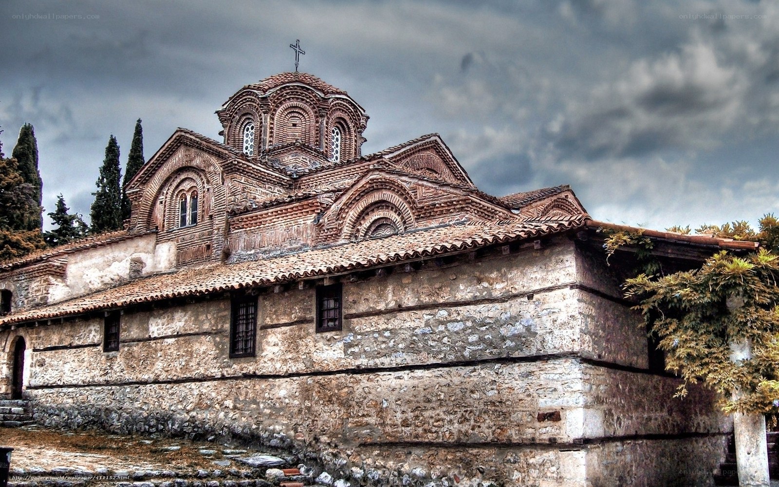 Ancient stone church with cross