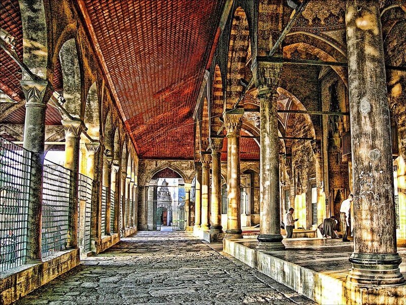 ancient stone corridor with columns